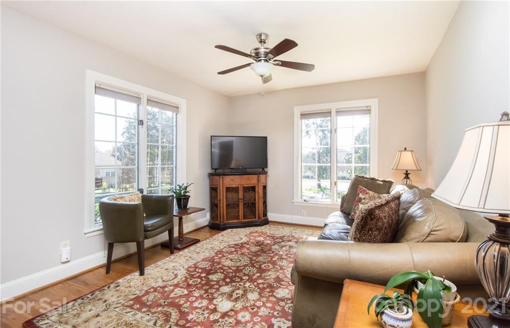 6955 Old Providence Road Charlotte, NC 28226 - Photo 14 of 44 a living room with furniture and a flat screen tv