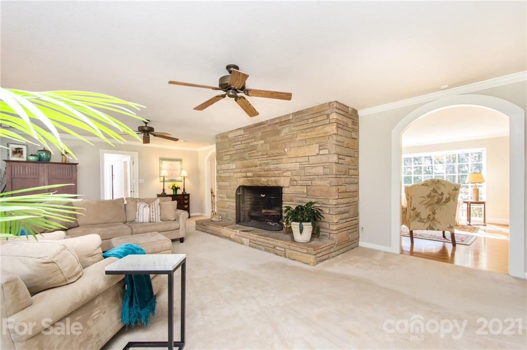 6955 Old Providence Road Charlotte, NC 28226 - Photo 15 of 44 a living room with furniture and a fireplace