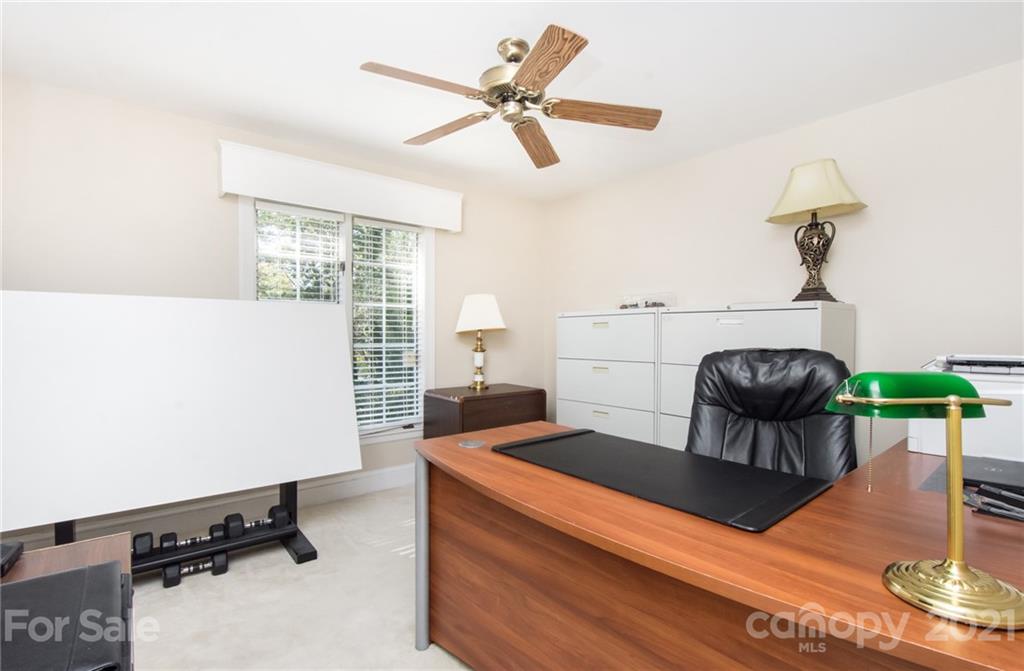 6955 Old Providence Road Charlotte, NC 28226 - Photo 25 of 44 a living room with a table chairs and a window
