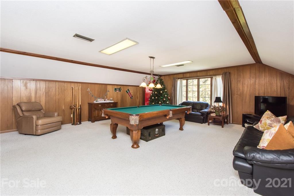 6955 Old Providence Road Charlotte, NC 28226 - Photo 29 of 44 a living room with furniture and a flat screen tv