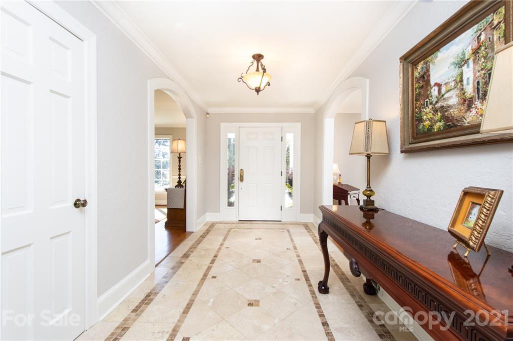 6955 Old Providence Road Charlotte, NC 28226 - Photo 4 of 44 a very nice looking room with a large window