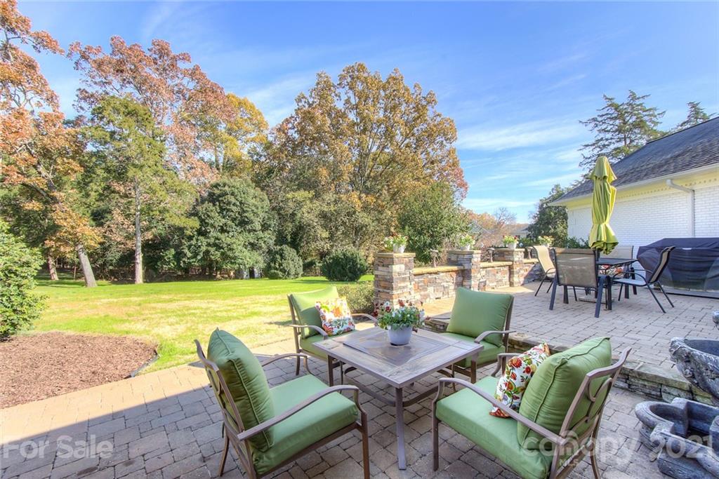 6955 Old Providence Road Charlotte, NC 28226 - Photo 31 of 44 a view of a swimming pool and outdoor seating
