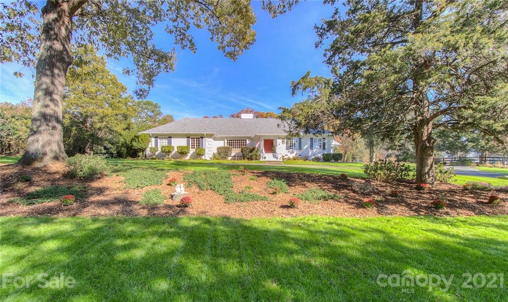 6955 Old Providence Road Charlotte, NC 28226 - Photo 38 of 44 a view of backyard with swimming pool and outdoor seating