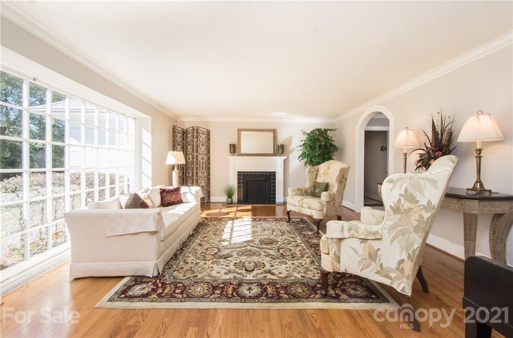 6955 Old Providence Road Charlotte, NC 28226 - Photo 7 of 44 a living room with furniture and a fireplace
