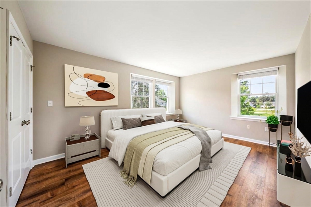 6 Bates Street, Unit A Devens, MA 01434 - Photo 21 of 41 a bedroom with a bed and a flat screen tv