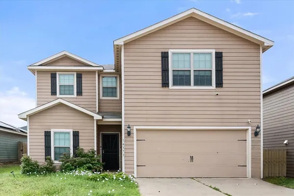 a front view of a house with yard