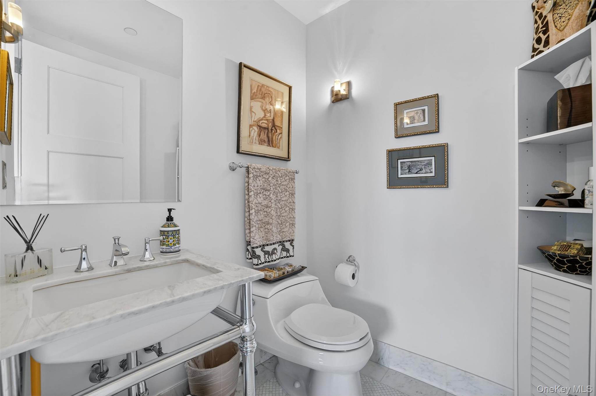 5 Renaissance Square, Unit 26E White Plains, NY 10601 - Photo 13 of 21 a bathroom with a toilet a sink and glass door