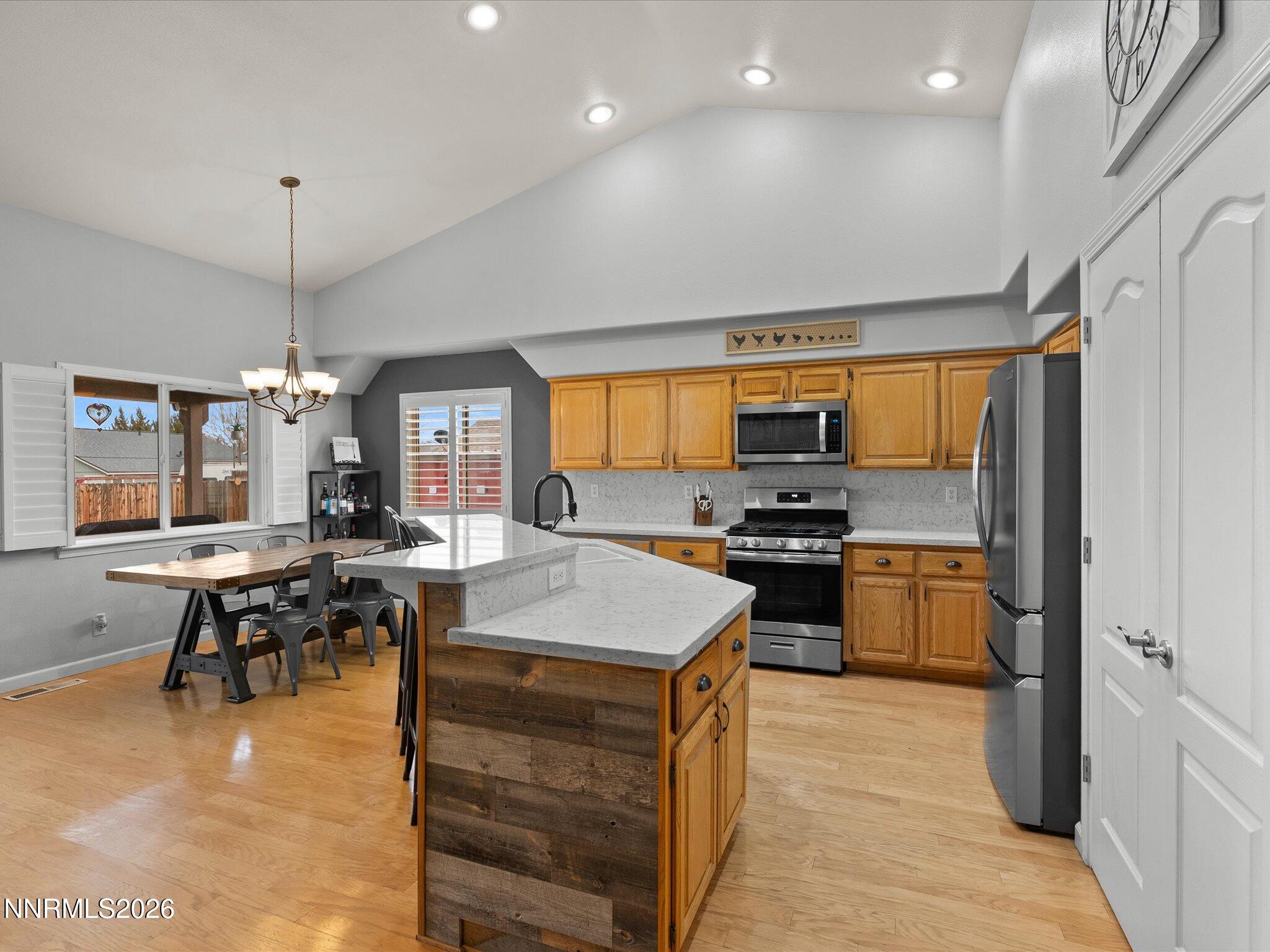 112 Alexander Court Fernley, NV 89408 - Photo 23 of 61 a kitchen with a sink stove and refrigerator