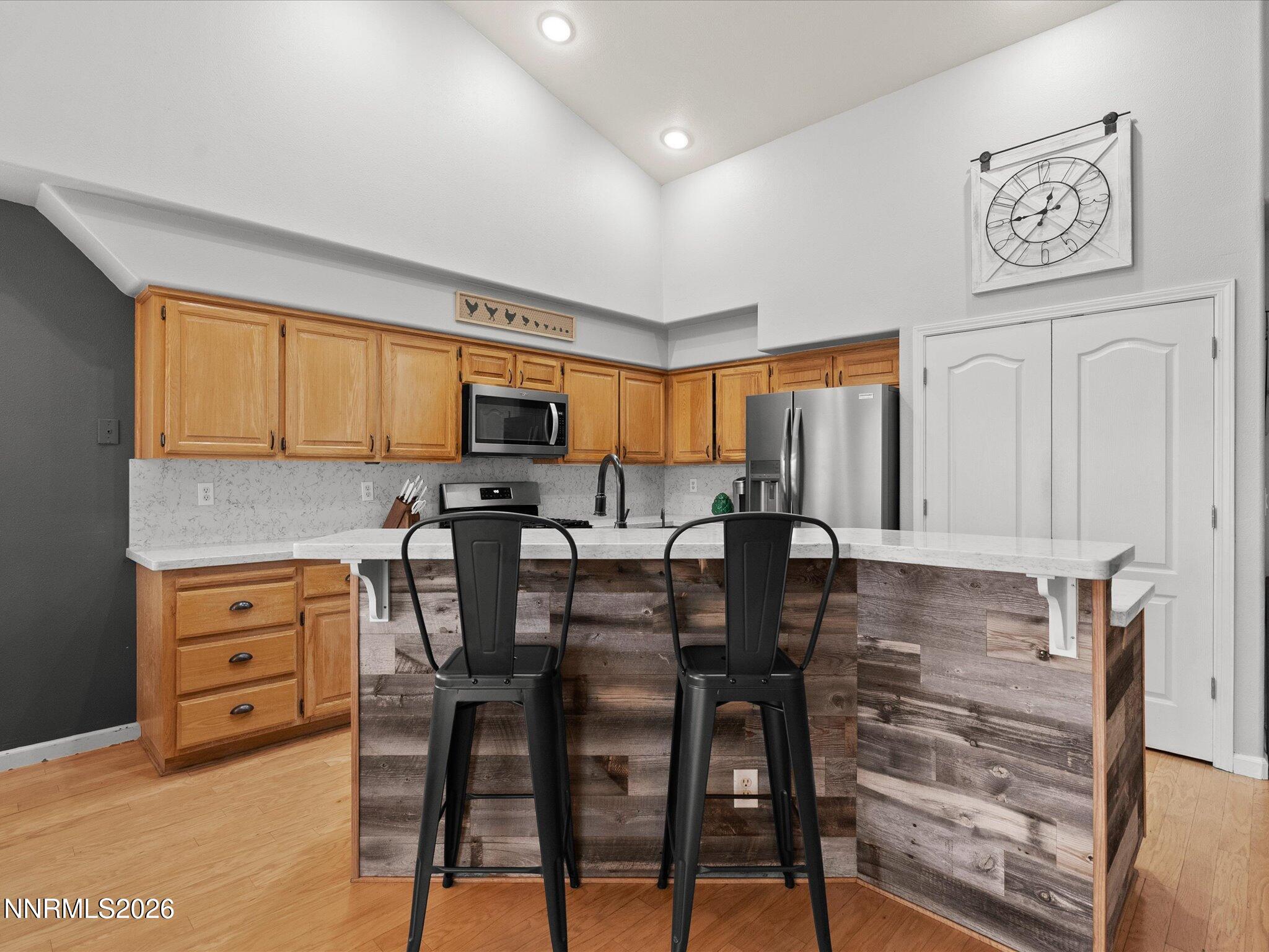 112 Alexander Court Fernley, NV 89408 - Photo 26 of 61 a view of kitchen with breakfast area