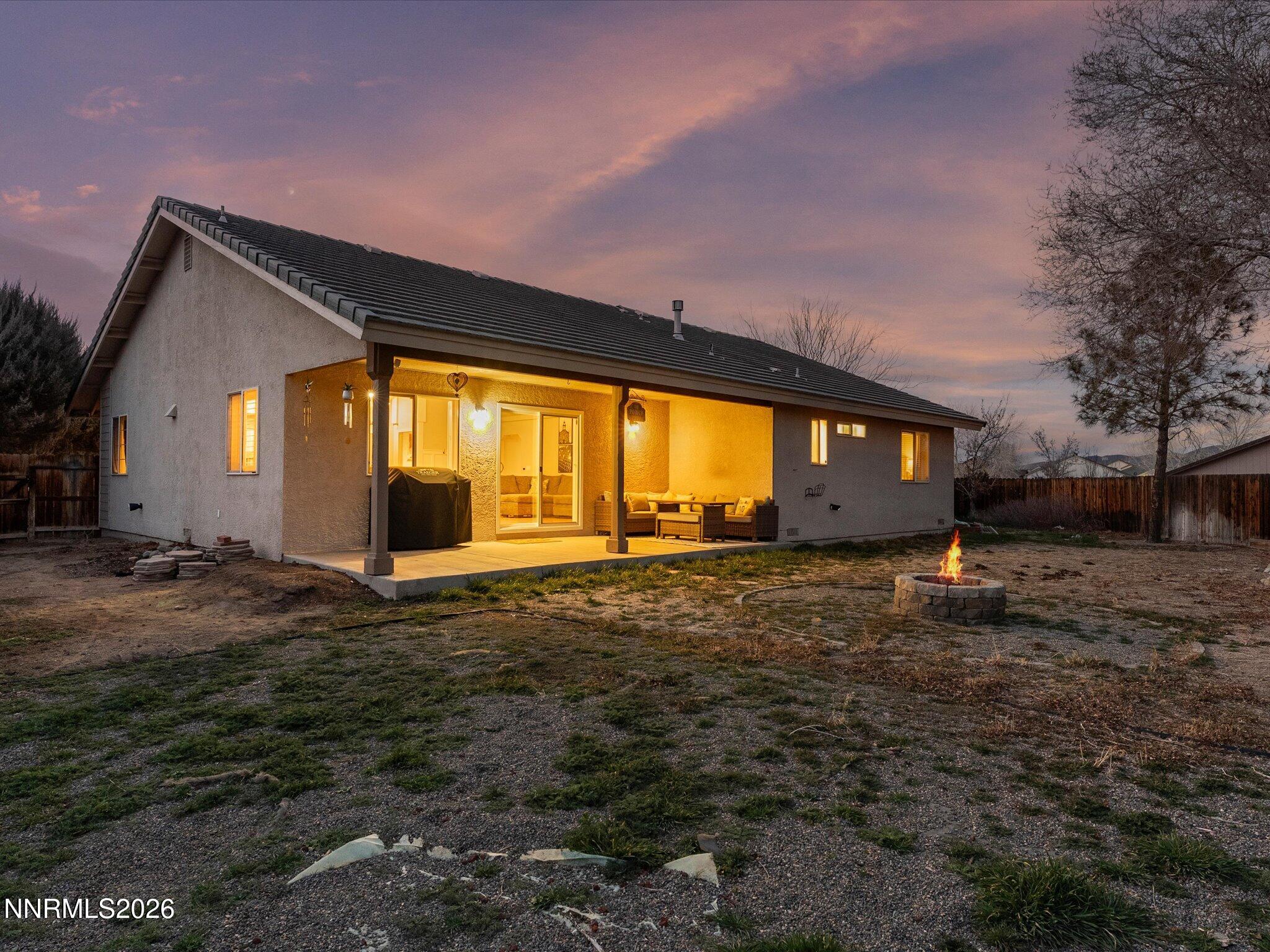 112 Alexander Court Fernley, NV 89408 - Photo 3 of 61 a view of a house with backyard and a tree