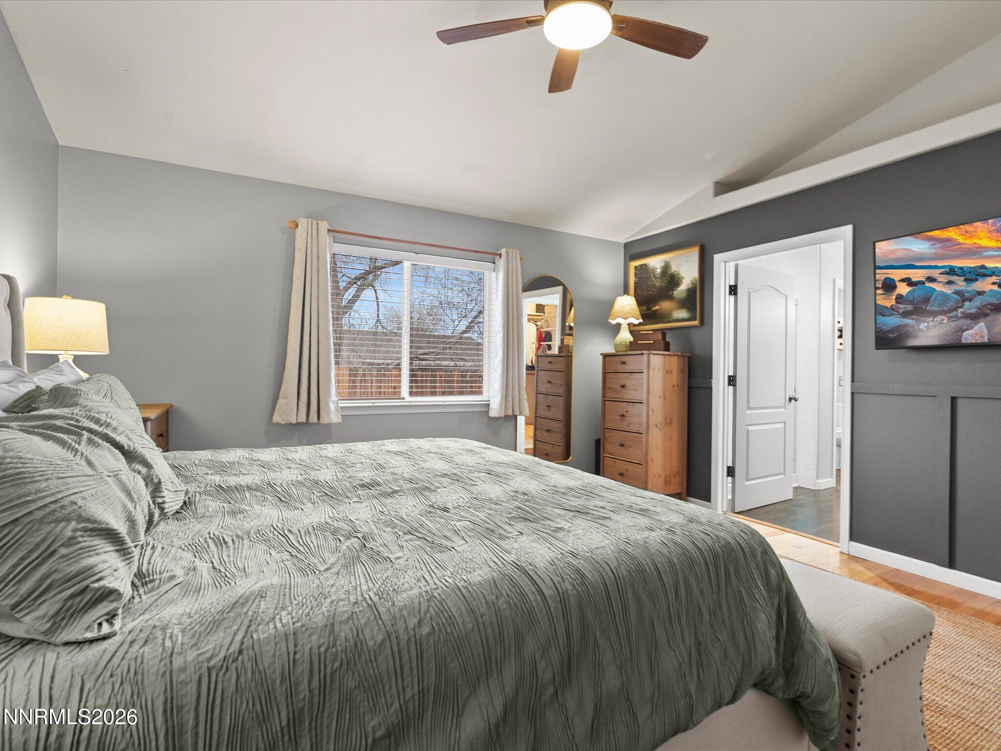 112 Alexander Court Fernley, NV 89408 - Photo 32 of 61 a bedroom with a large bed and a tv