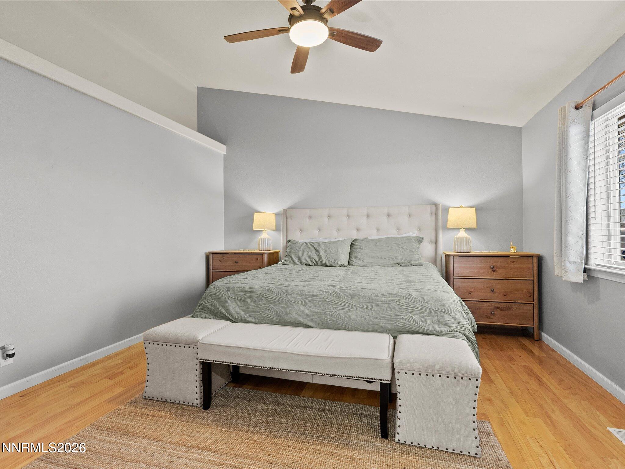 112 Alexander Court Fernley, NV 89408 - Photo 33 of 61 a bedroom with a bed and window