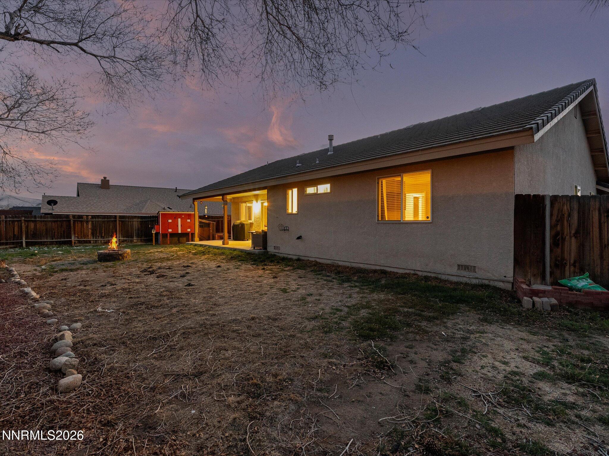 112 Alexander Court Fernley, NV 89408 - Photo 4 of 61 a front view of a house with a yard