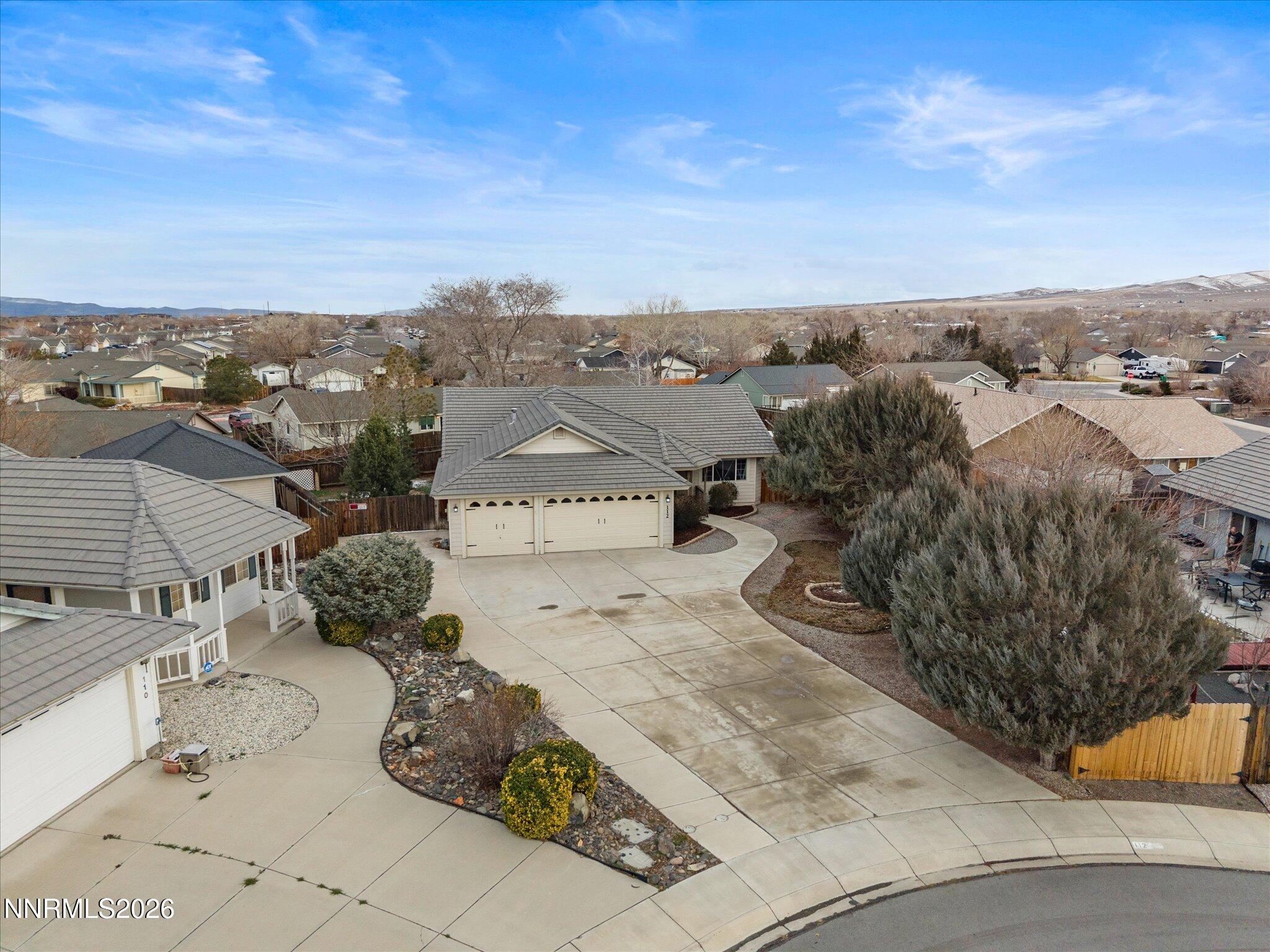 112 Alexander Court Fernley, NV 89408 - Photo 41 of 61 an aerial view of a house with a garden