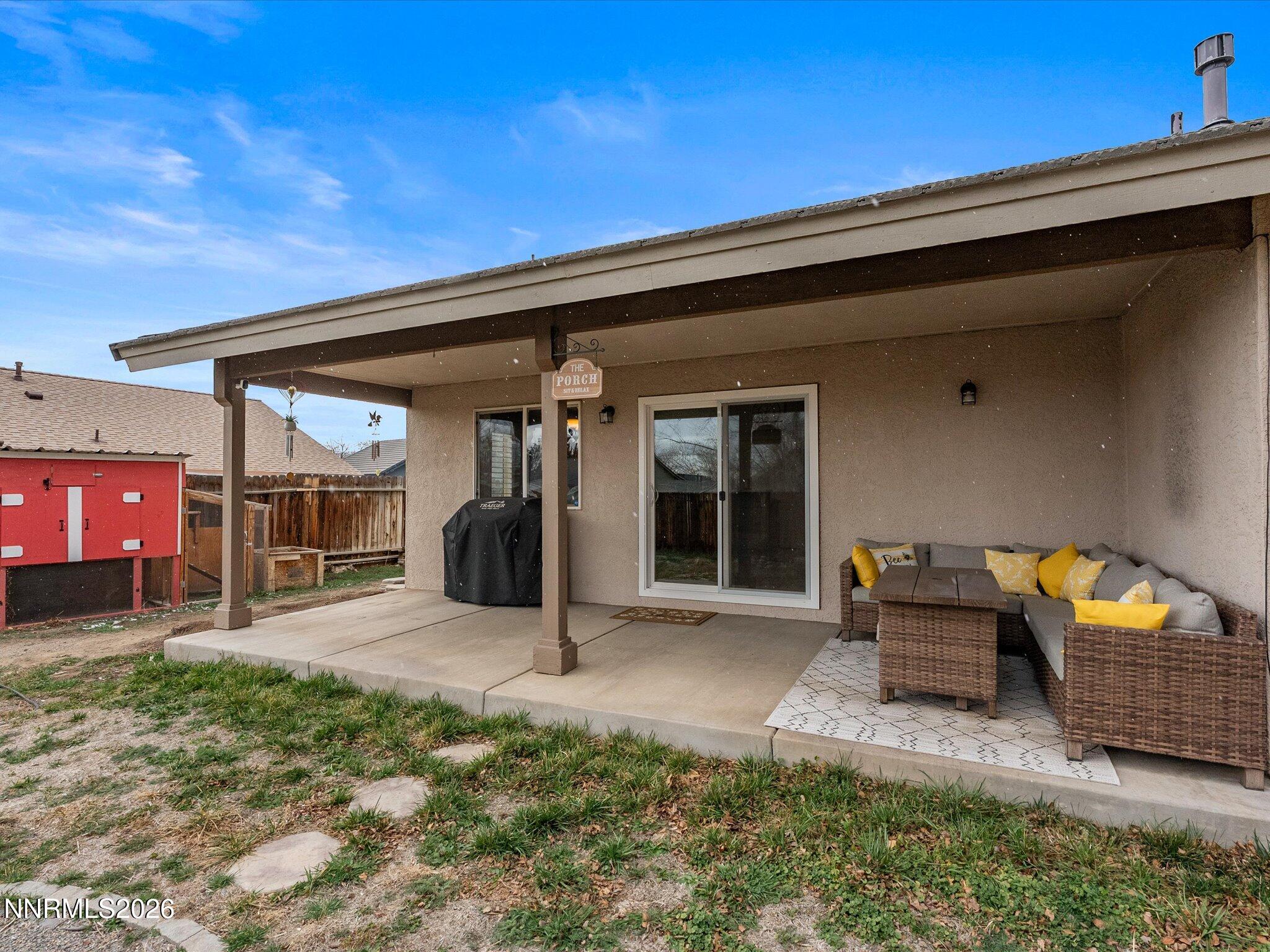 112 Alexander Court Fernley, NV 89408 - Photo 52 of 61 a backyard of a house with yard fire pit and outdoor seating