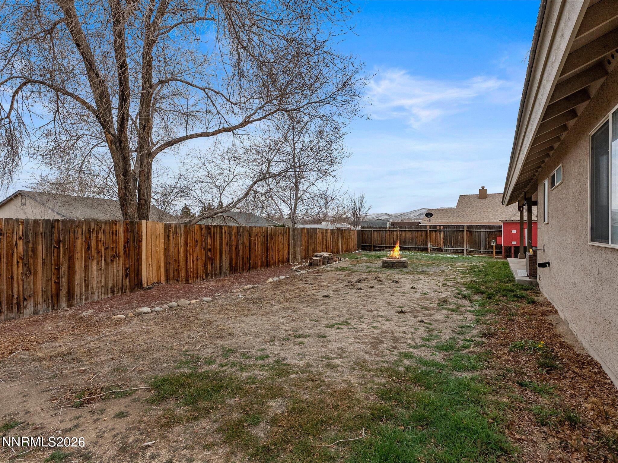 112 Alexander Court Fernley, NV 89408 - Photo 57 of 61 a backyard of a house with lots of green space