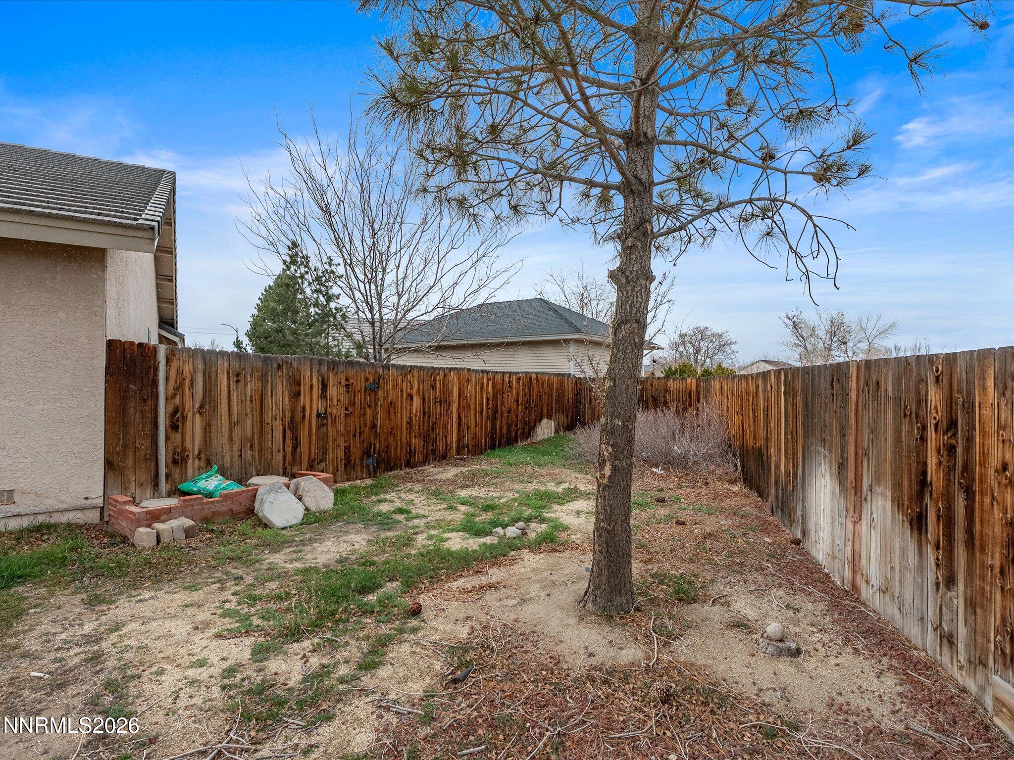 112 Alexander Court Fernley, NV 89408 - Photo 59 of 61 a backyard of a house with lots of green space
