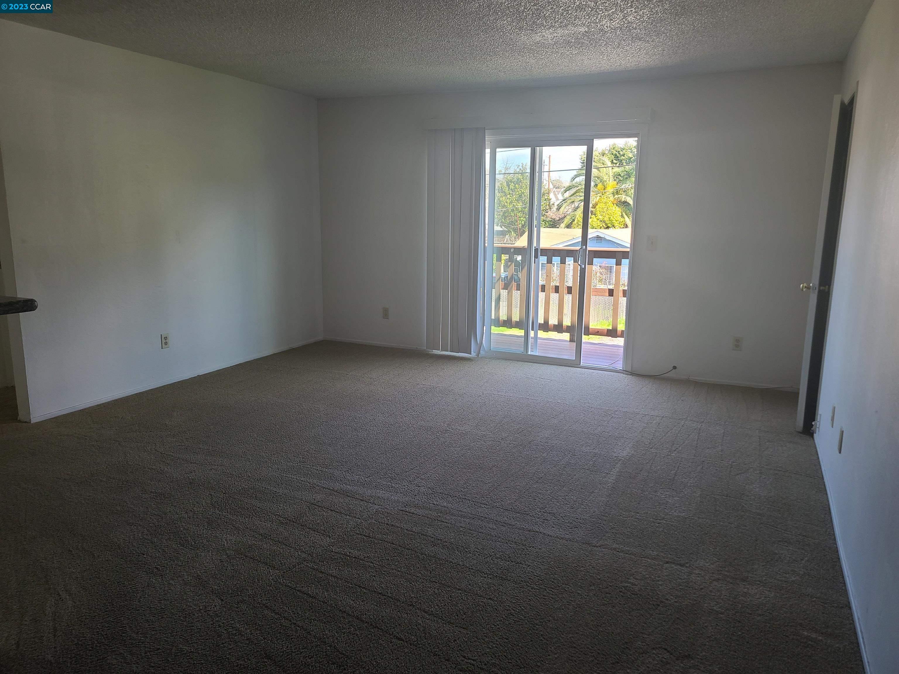 322 Vaqueros Avenue Rodeo, CA 94572 - Photo 2 of 6 a view of an empty room with a window
