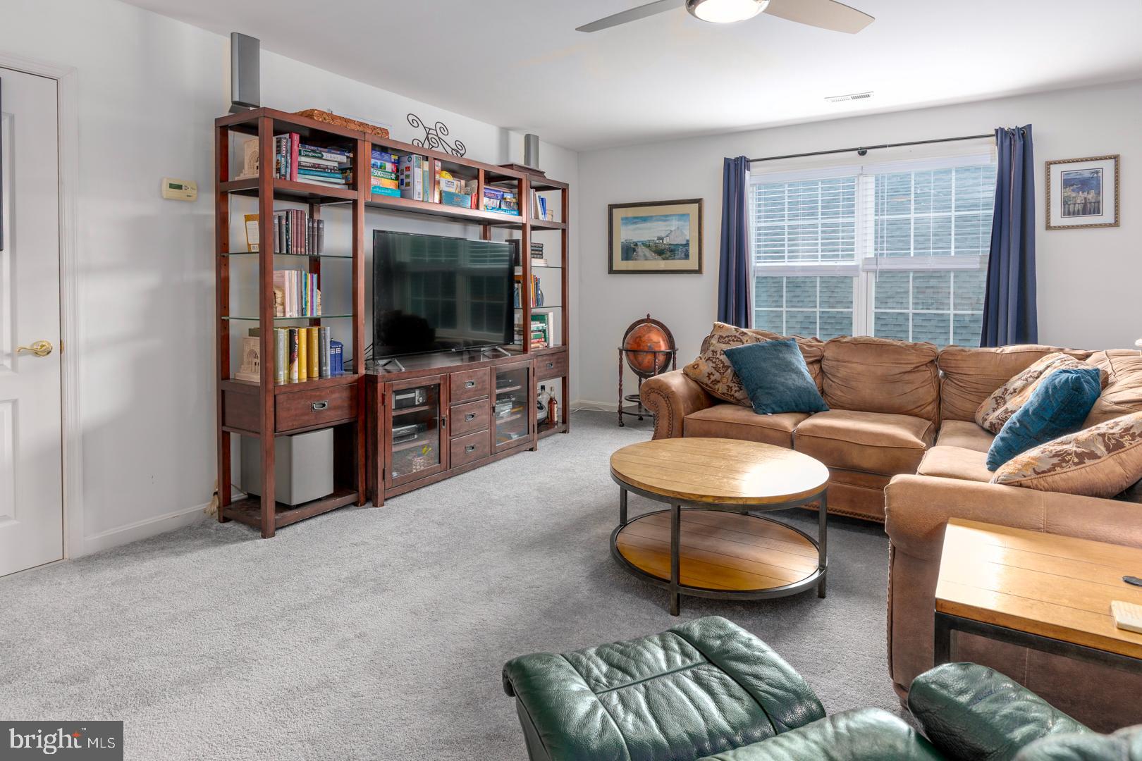 250 Concerto Avenue Centreville, MD 21617 - Photo 11 of 34 a living room with furniture a window and a flat screen tv