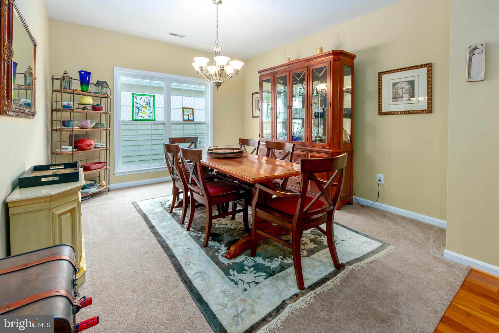 250 Concerto Avenue Centreville, MD 21617 - Photo 29 of 34 a view of a dining room with furniture window and wooden floor