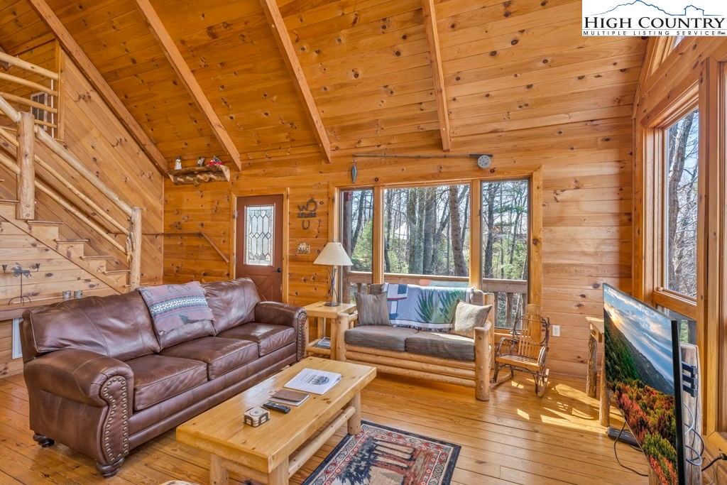 2095 Elk Ridge Road Ferguson, NC 28624 - Photo 17 of 34 a living room with furniture and a rug