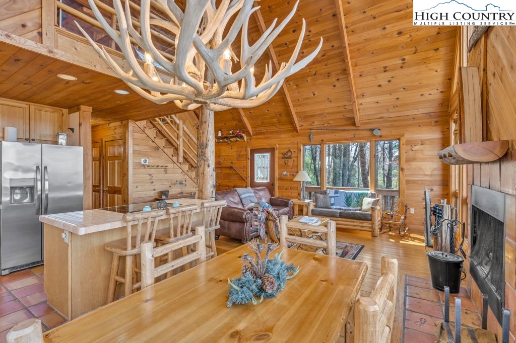 2095 Elk Ridge Road Ferguson, NC 28624 - Photo 19 of 34 a living room with fireplace furniture and a wooden floor