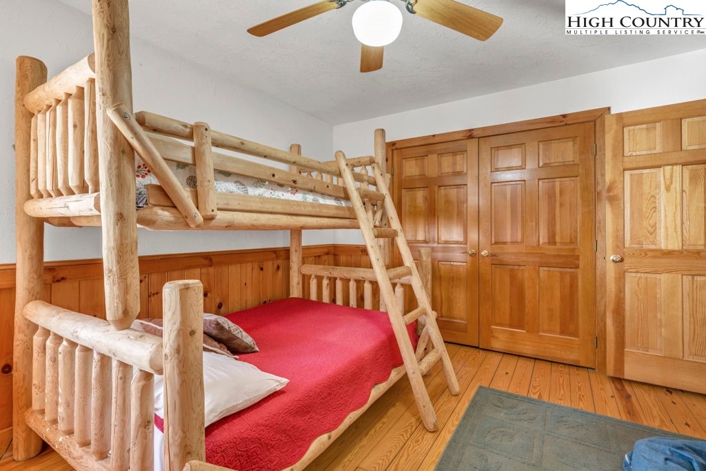 2095 Elk Ridge Road Ferguson, NC 28624 - Photo 28 of 34 a bed room with a bed and windows