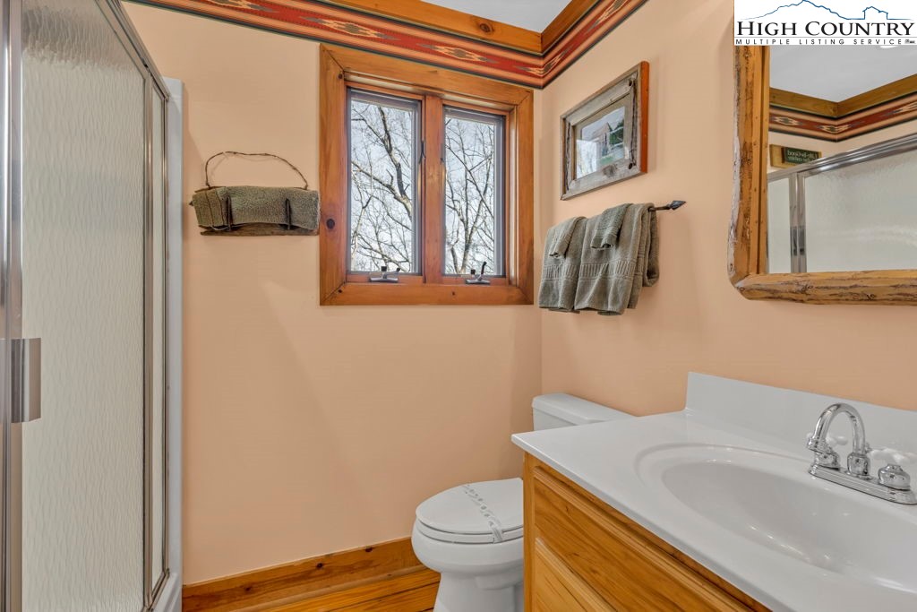 2095 Elk Ridge Road Ferguson, NC 28624 - Photo 33 of 34 a bathroom with a sink and a toilet