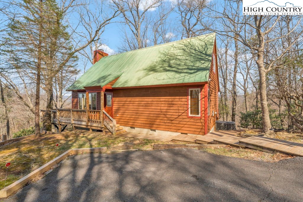 2095 Elk Ridge Road Ferguson, NC 28624 - Photo 4 of 34 a view of a house with a snow on the road