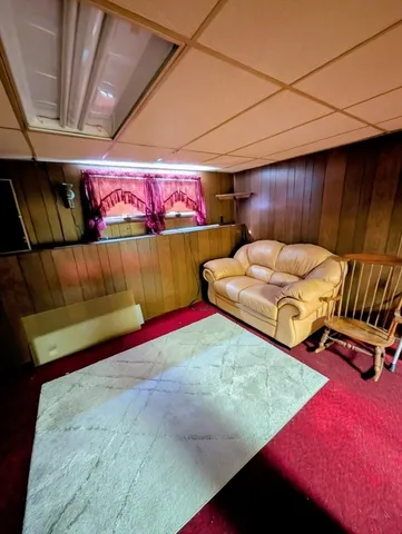 a view of a backyard with sitting area