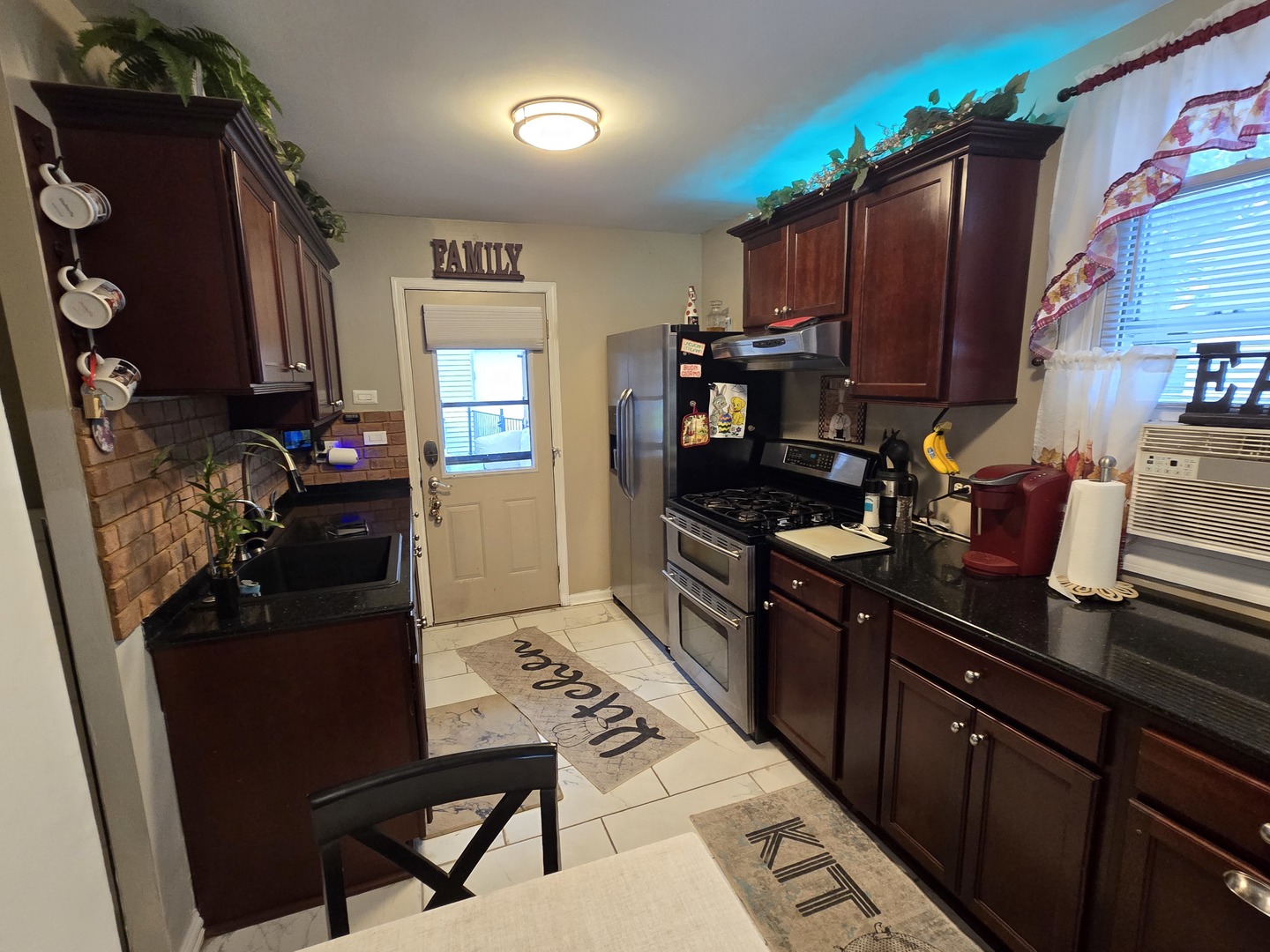 14932 Kedvale Avenue Midlothian, IL 60445 - Photo 4 of 17 a kitchen with a refrigerator and a stove top oven