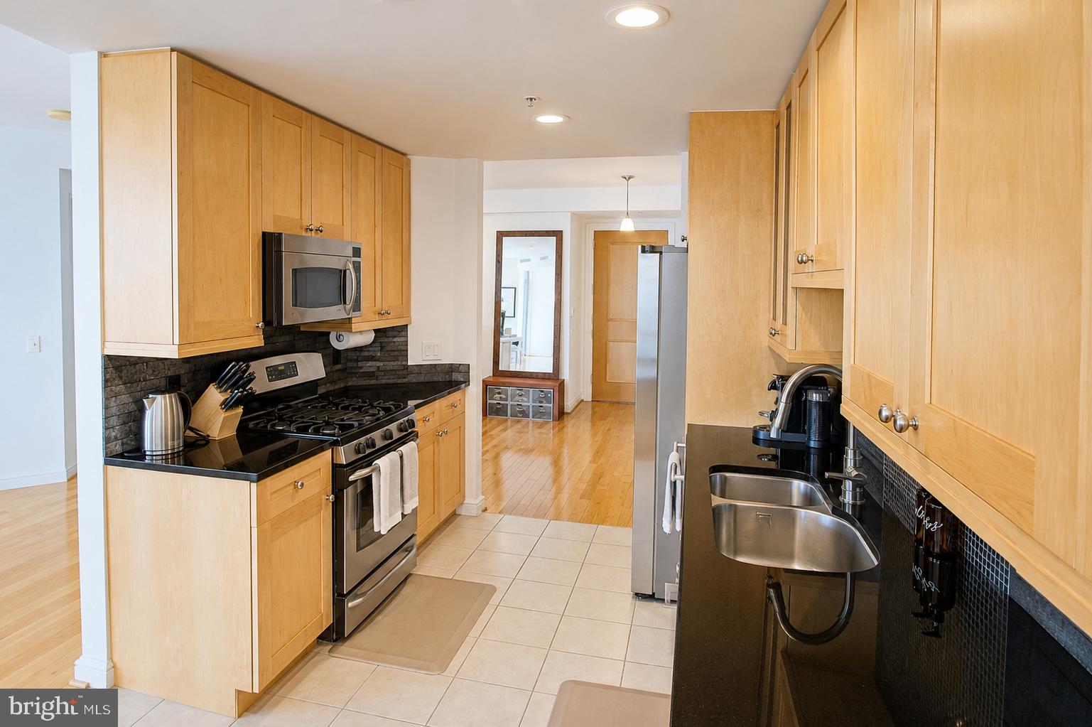 11990 Market Street, Unit 1403 Reston, VA 20190 - Photo 6 of 58 Double sink, and granite tops in kitchen