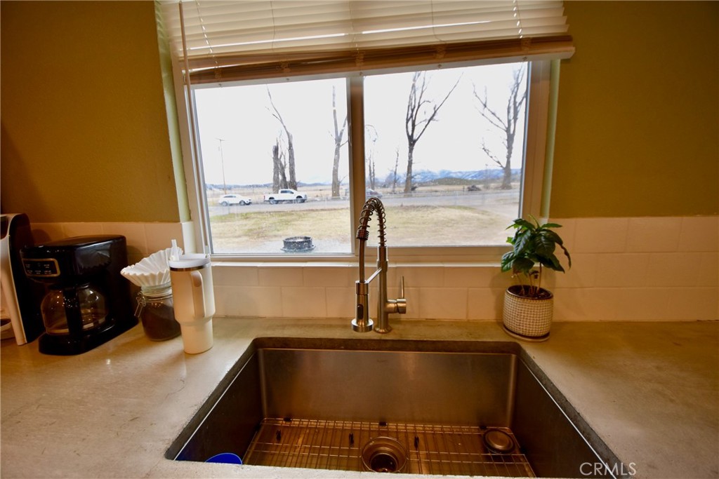 935 Truttman Lane Grenada, CA 96038 - Photo 11 of 44 a kitchen with a window a sink and a counter top