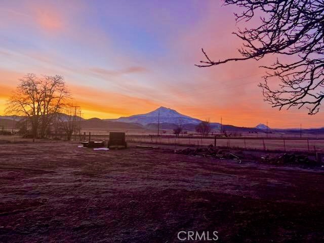 935 Truttman Lane Grenada, CA 96038 - Photo 2 of 44 a view of a yard with wooden fence