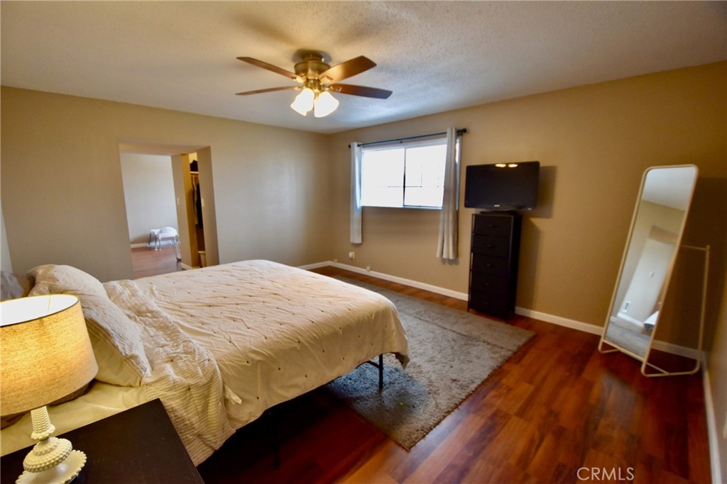 935 Truttman Lane Grenada, CA 96038 - Photo 27 of 44 a bedroom with a bed and wooden floor