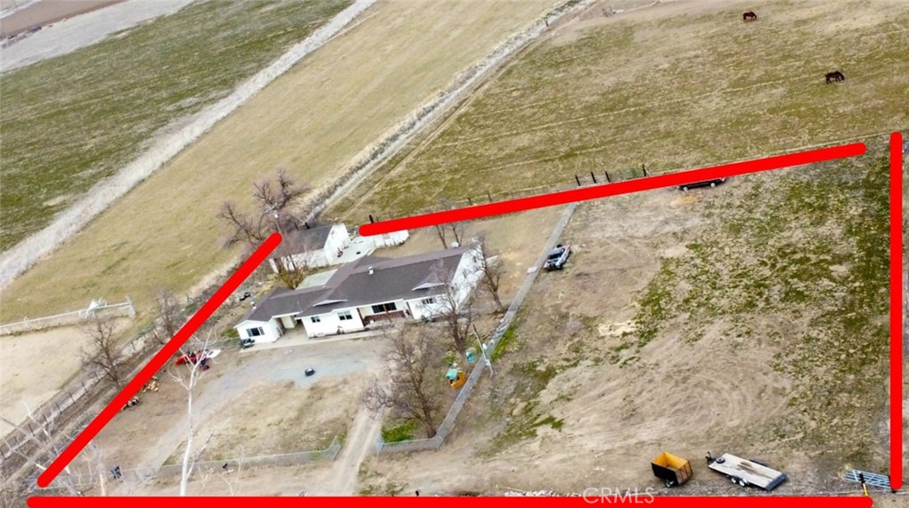 935 Truttman Lane Grenada, CA 96038 - Photo 39 of 44 a white and red umbrella sitting in front of a building