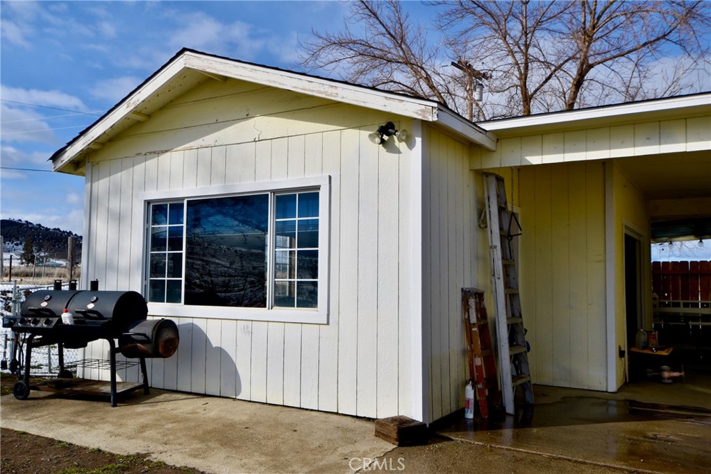 935 Truttman Lane Grenada, CA 96038 - Photo 44 of 44 a view of a house with a barbeque and chair