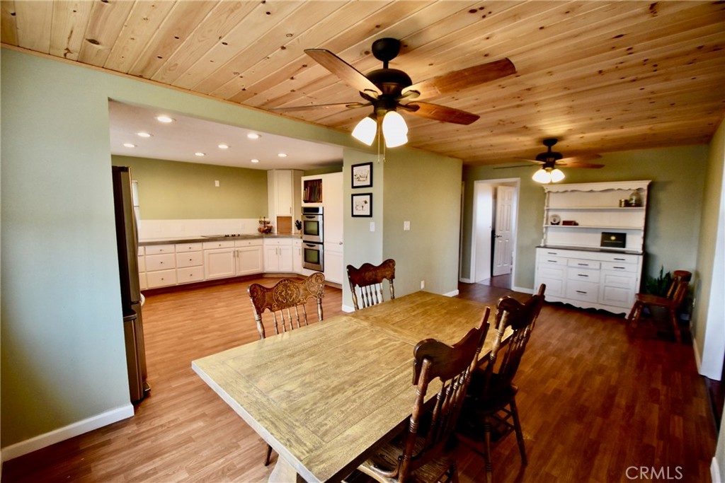 935 Truttman Lane Grenada, CA 96038 - Photo 7 of 44 a view of a dining area with furniture and wooden floor