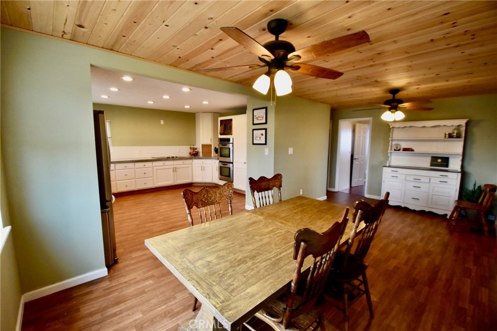 935 Truttman Lane Grenada, CA 96038 - Photo 8 of 44 a view of a dining room with furniture and wooden floor
