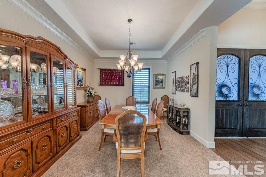 9850 Firefoot Lane Reno, NV 89521 - Photo 12 of 40 a dining room with furniture window and wooden floor