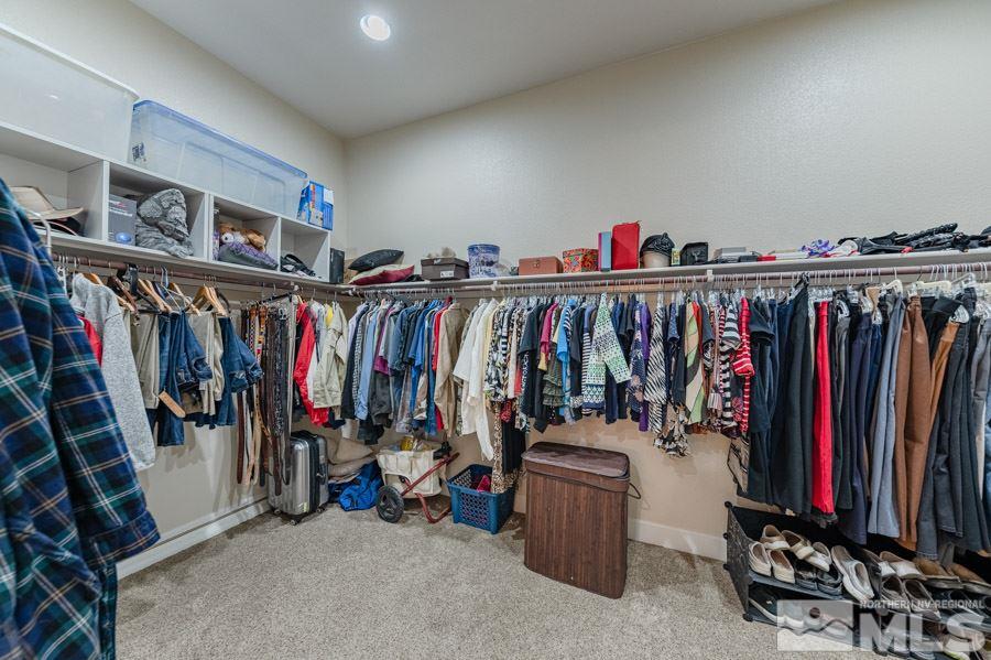 9850 Firefoot Lane Reno, NV 89521 - Photo 18 of 40 a view of walk in closet with clothes