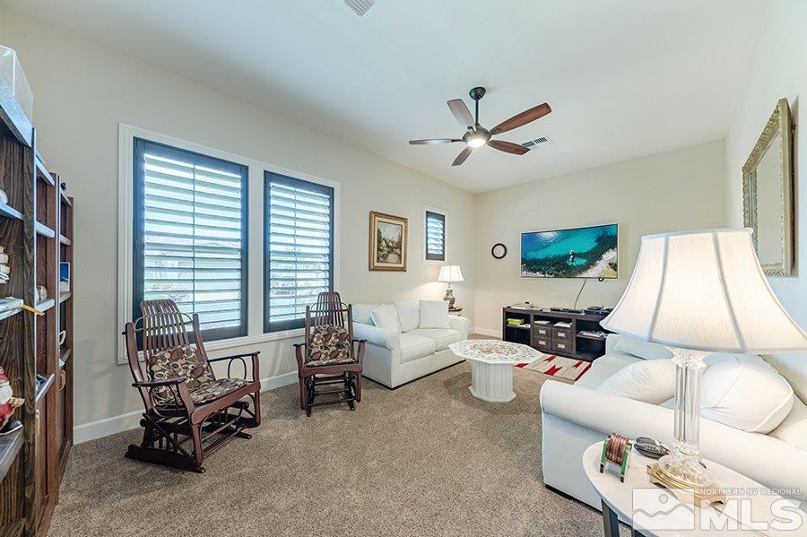 9850 Firefoot Lane Reno, NV 89521 - Photo 19 of 40 a living room with furniture and a large window