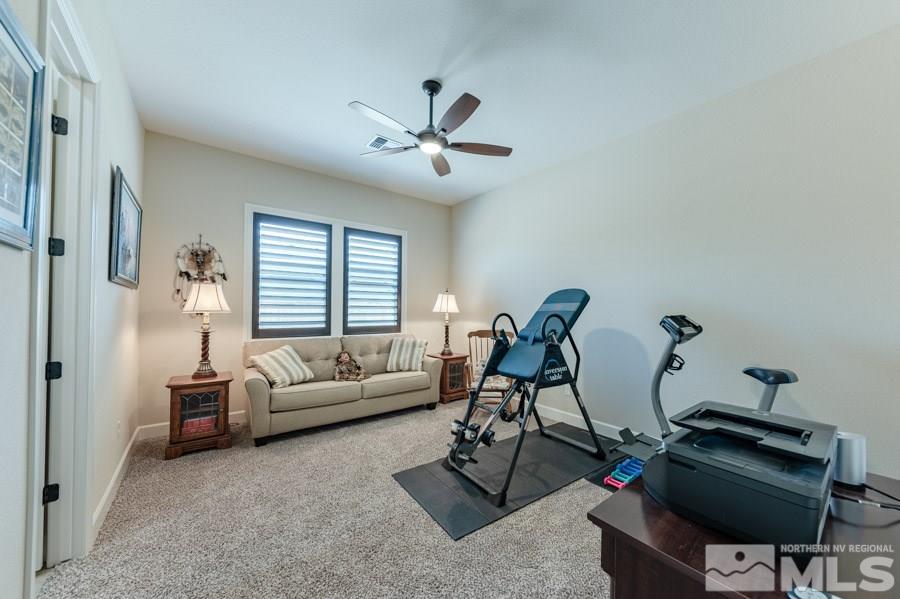 9850 Firefoot Lane Reno, NV 89521 - Photo 20 of 40 a living room with furniture a air conditioner and a window