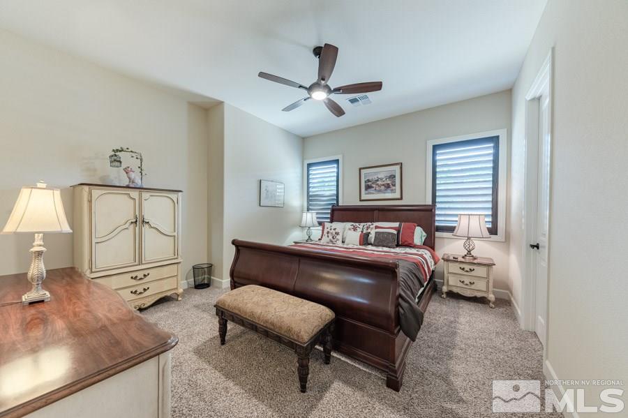 9850 Firefoot Lane Reno, NV 89521 - Photo 22 of 40 a bedroom with a bed and a couch