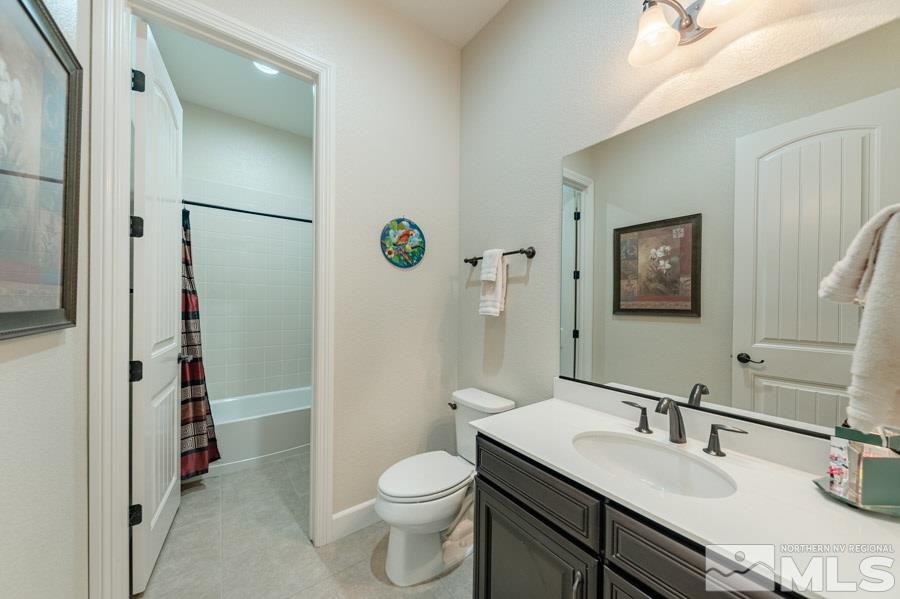 9850 Firefoot Lane Reno, NV 89521 - Photo 23 of 40 a bathroom with a sink toilet and shower