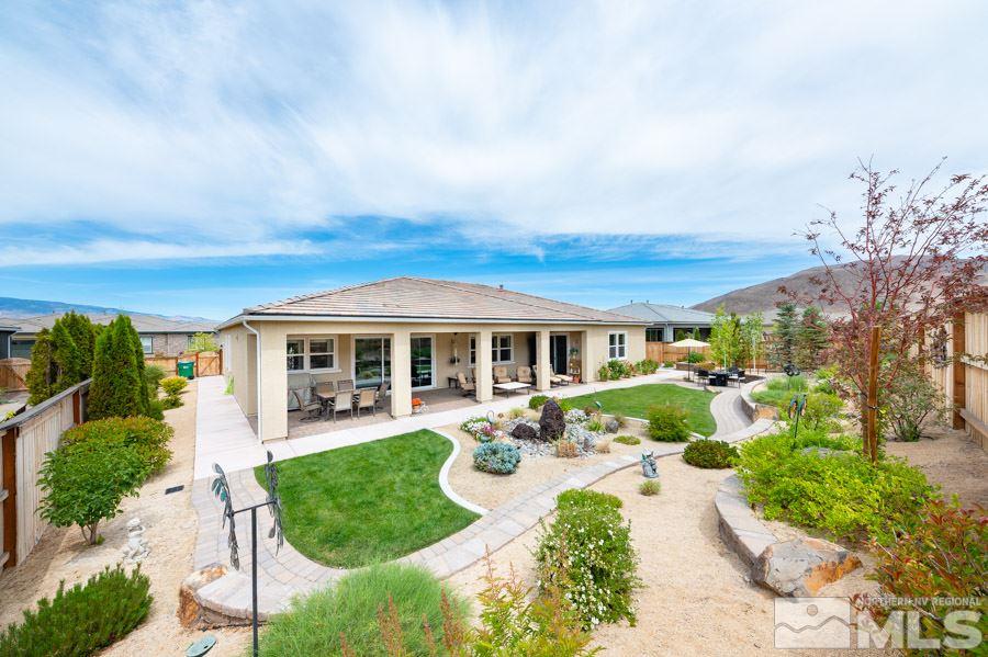 9850 Firefoot Lane Reno, NV 89521 - Photo 25 of 40 a front view of a house with garden