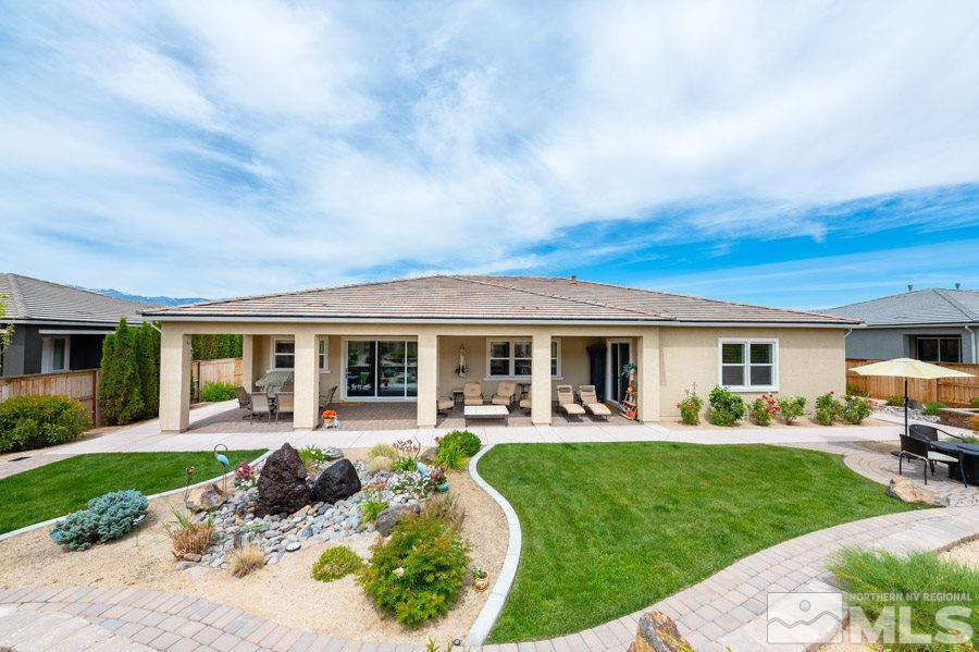 9850 Firefoot Lane Reno, NV 89521 - Photo 26 of 40 a front view of house with a garden and patio