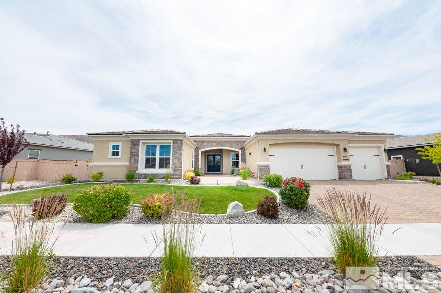 9850 Firefoot Lane Reno, NV 89521 - Photo 3 of 40 a front view of a house with a yard and garage