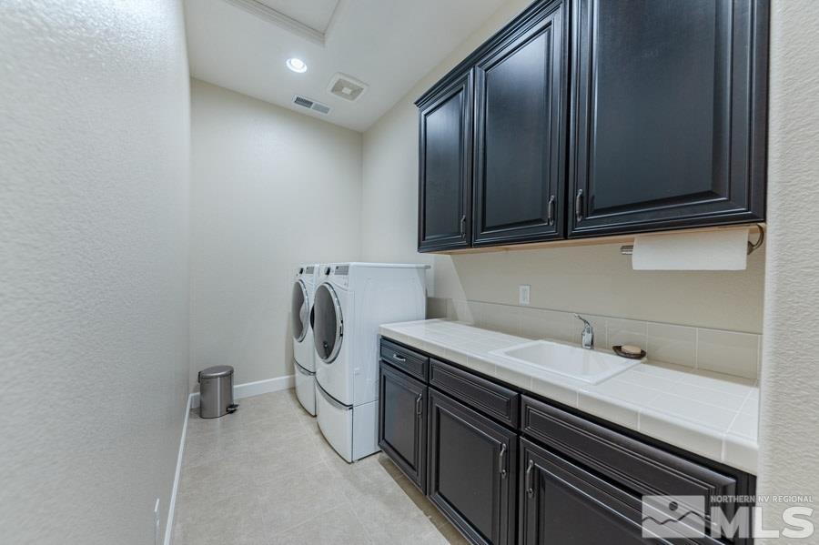 9850 Firefoot Lane Reno, NV 89521 - Photo 32 of 40 a utility room with cabinets