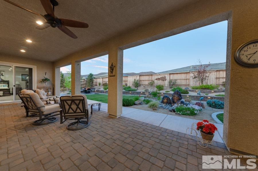 9850 Firefoot Lane Reno, NV 89521 - Photo 33 of 40 a building outdoor space with patio furniture and potted plants